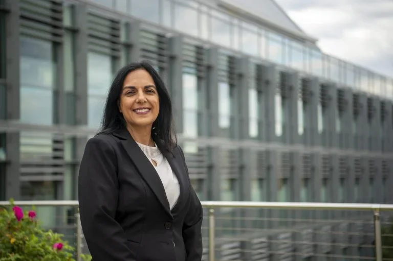 Lisa Singh, the director of the Massive Data Institute, standing in front of a building